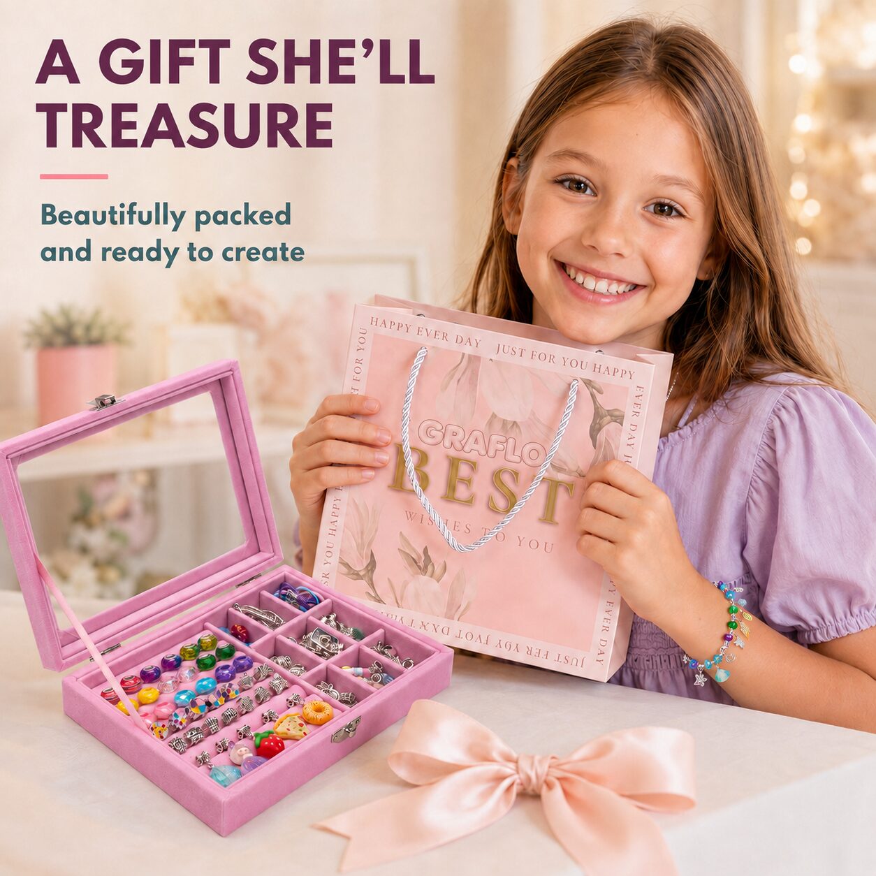A girl holding the GRAFLO gift bag beside the open pink jewellery box, presented as a gift
