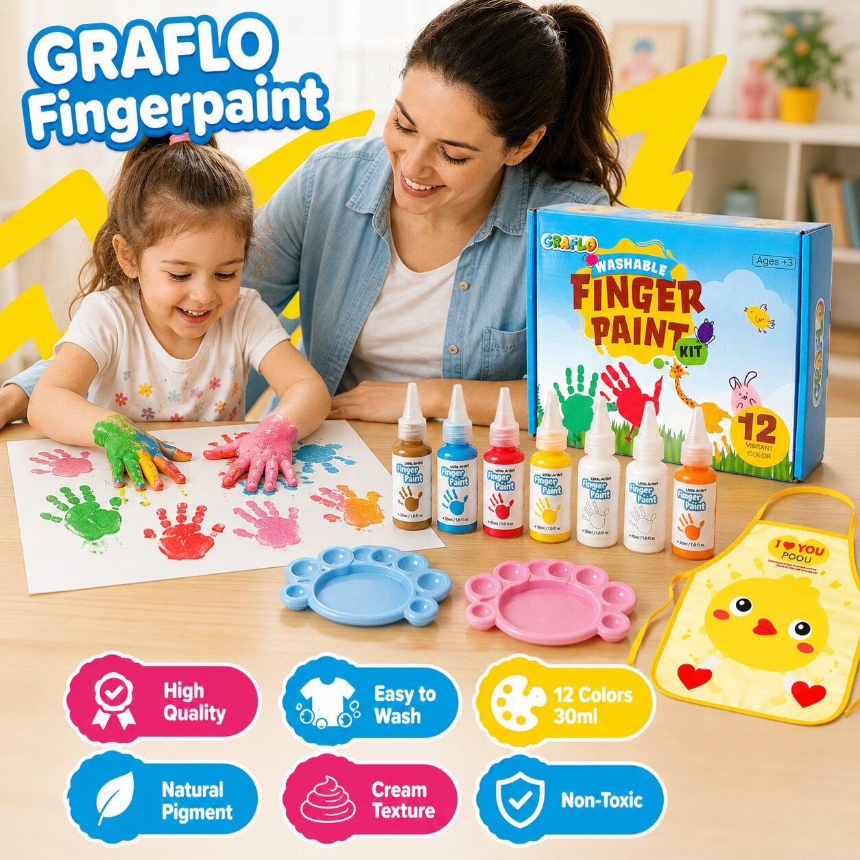 Child making handprints at a table beside the GRAFLO box, paint bottles, two palettes and the chick apron, labelled high quality, easy to wash, 12 colours 30 ml, natural pigment, cream texture and non-toxic