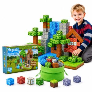 A boy building a pixel-art house and waterfall scene from GRAFLO magnetic building cubes, with the 100-piece retail box, green storage bag and loose cubes