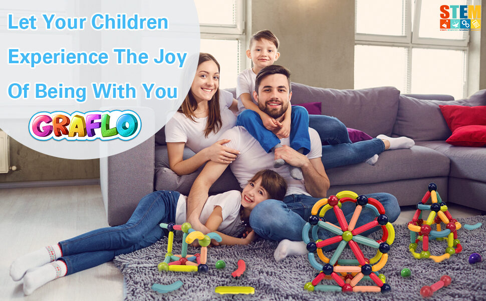 A family relaxing together on a sofa with GRAFLO magnetic stick builds on the floor
