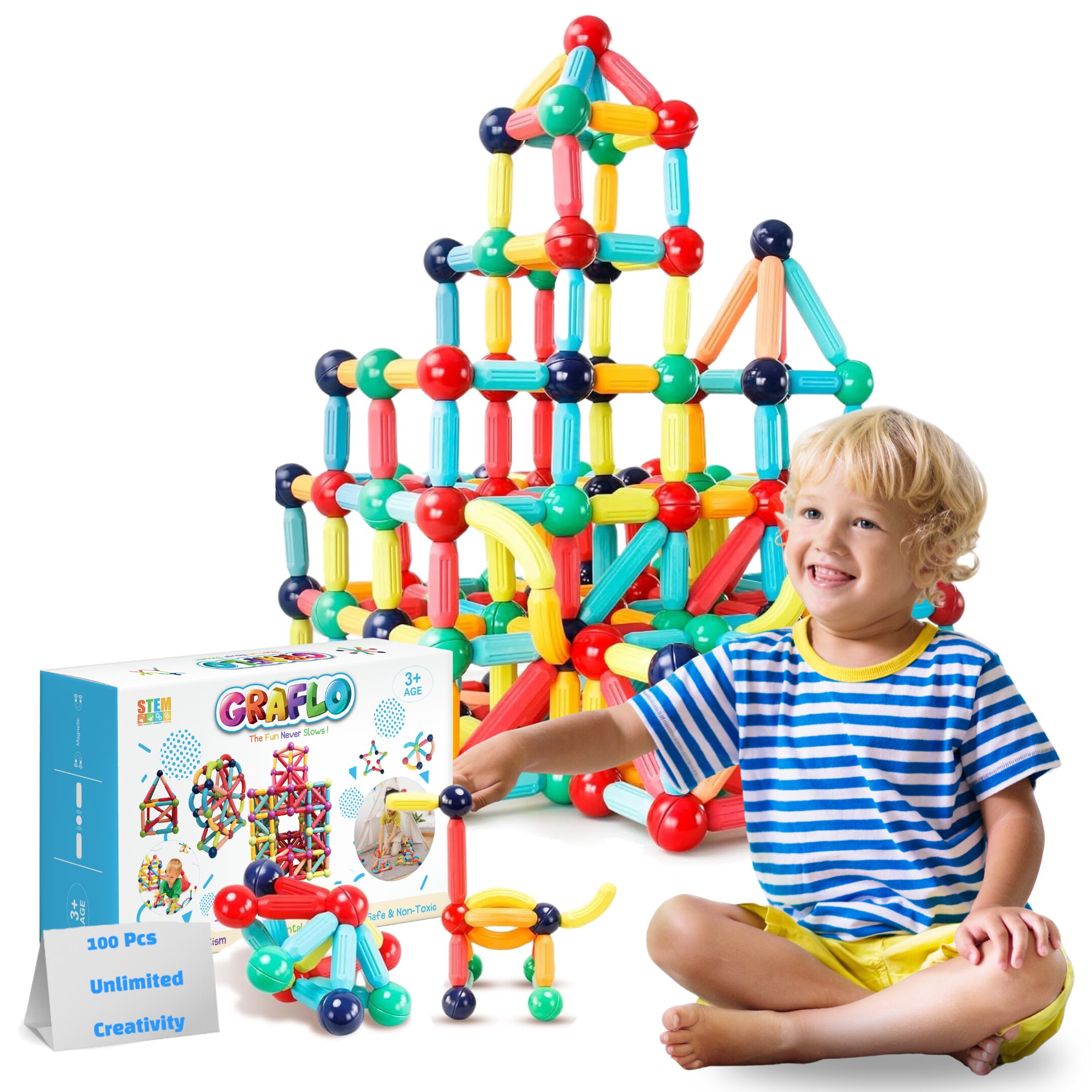 A boy building a large tower from GRAFLO magnetic sticks and balls, with the 100-piece retail box