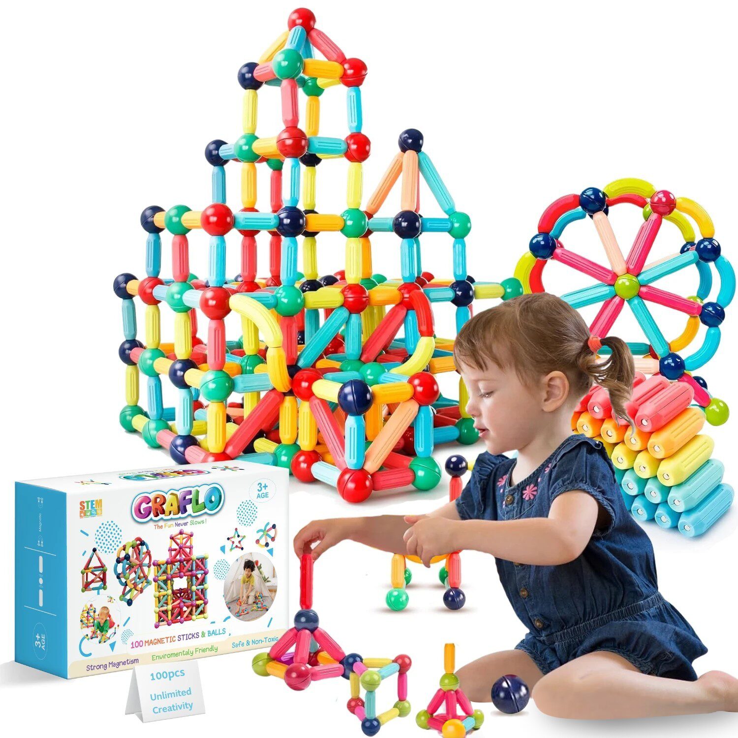 A girl building a large structure from GRAFLO magnetic sticks and balls beside the 100-piece box