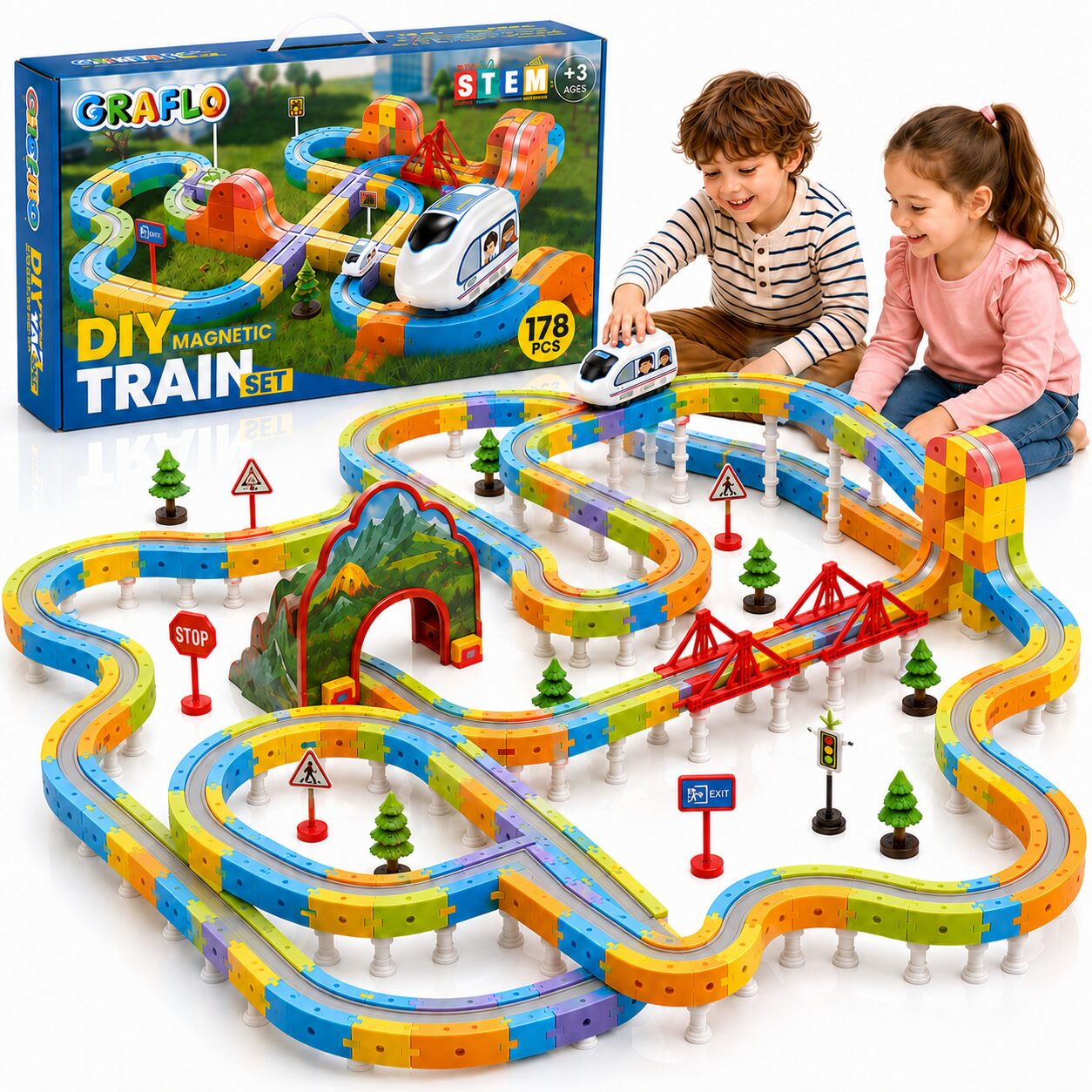 GRAFLO 178-piece magnetic train set box beside the assembled track, with two children playing