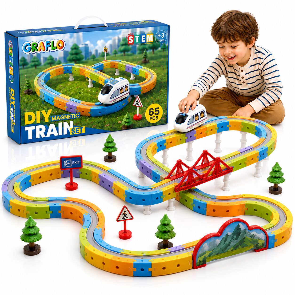 GRAFLO 65-piece magnetic train set box beside the assembled track, with a boy playing