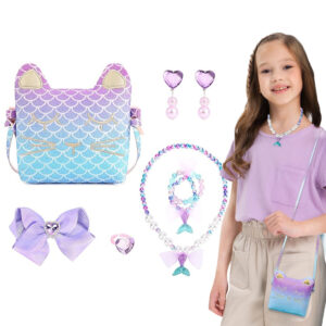 Mermaid purse and jewellery set for girls laid out on white: a mermaid-scale cat-face crossbody purse in purple and blue, heart earrings, a beaded necklace with a mermaid-tail charm, a beaded bracelet, a lilac hair bow and a heart ring, with a girl wearing the necklace and the purse