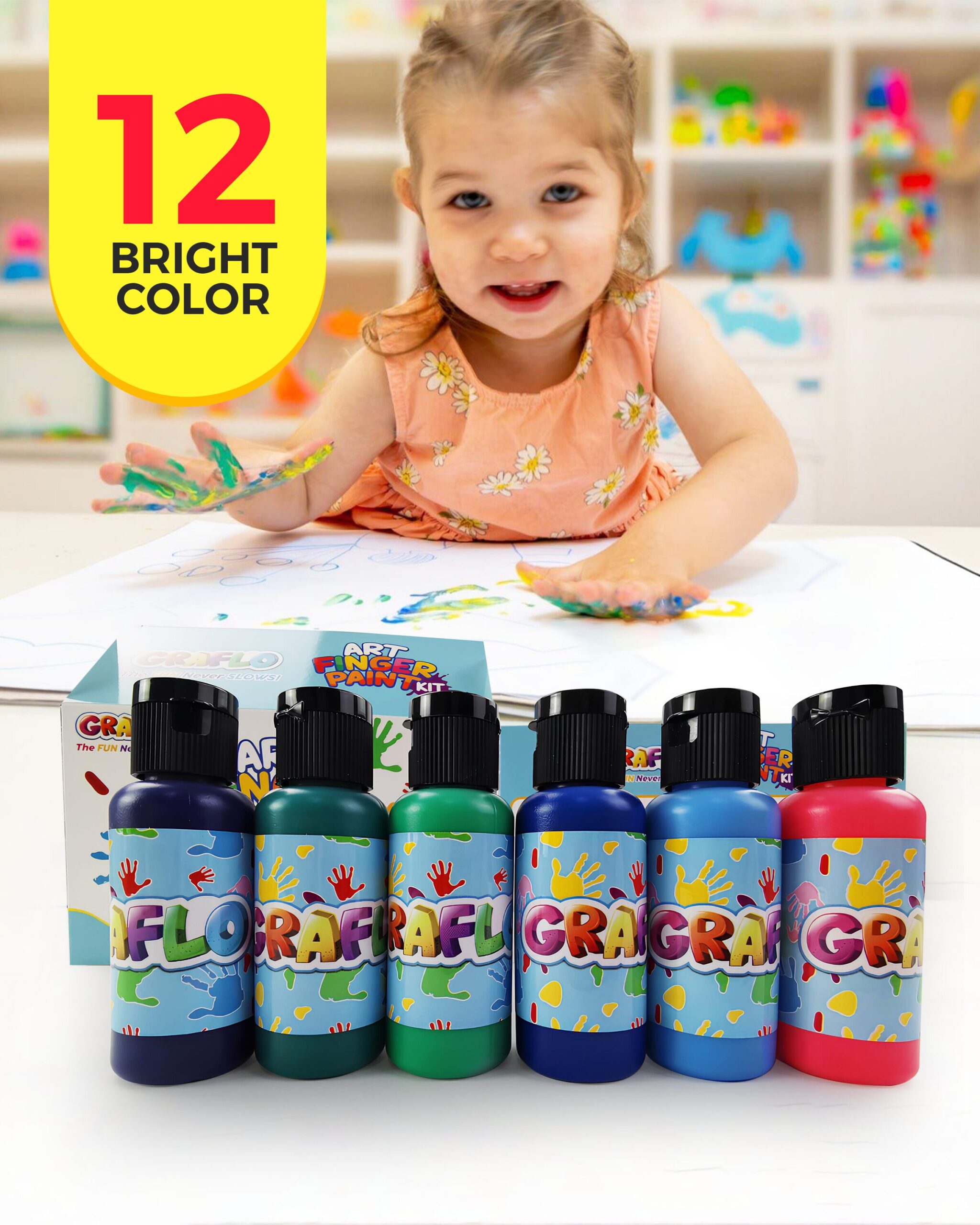 A child's hands pressing painted handprints onto paper with GRAFLO finger paint